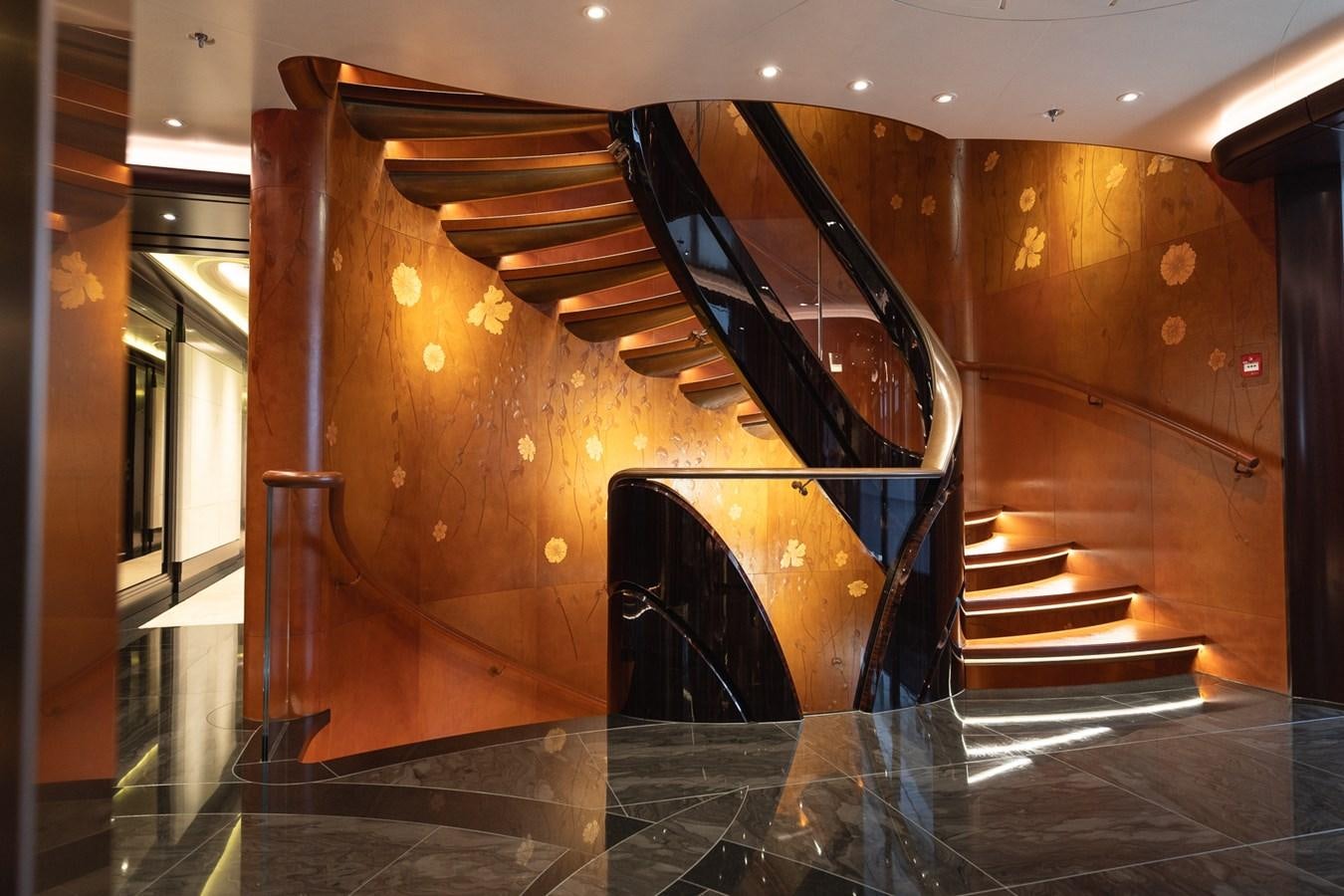 a large glass case with a spiral staircase aboard WHISPER Yacht for Sale