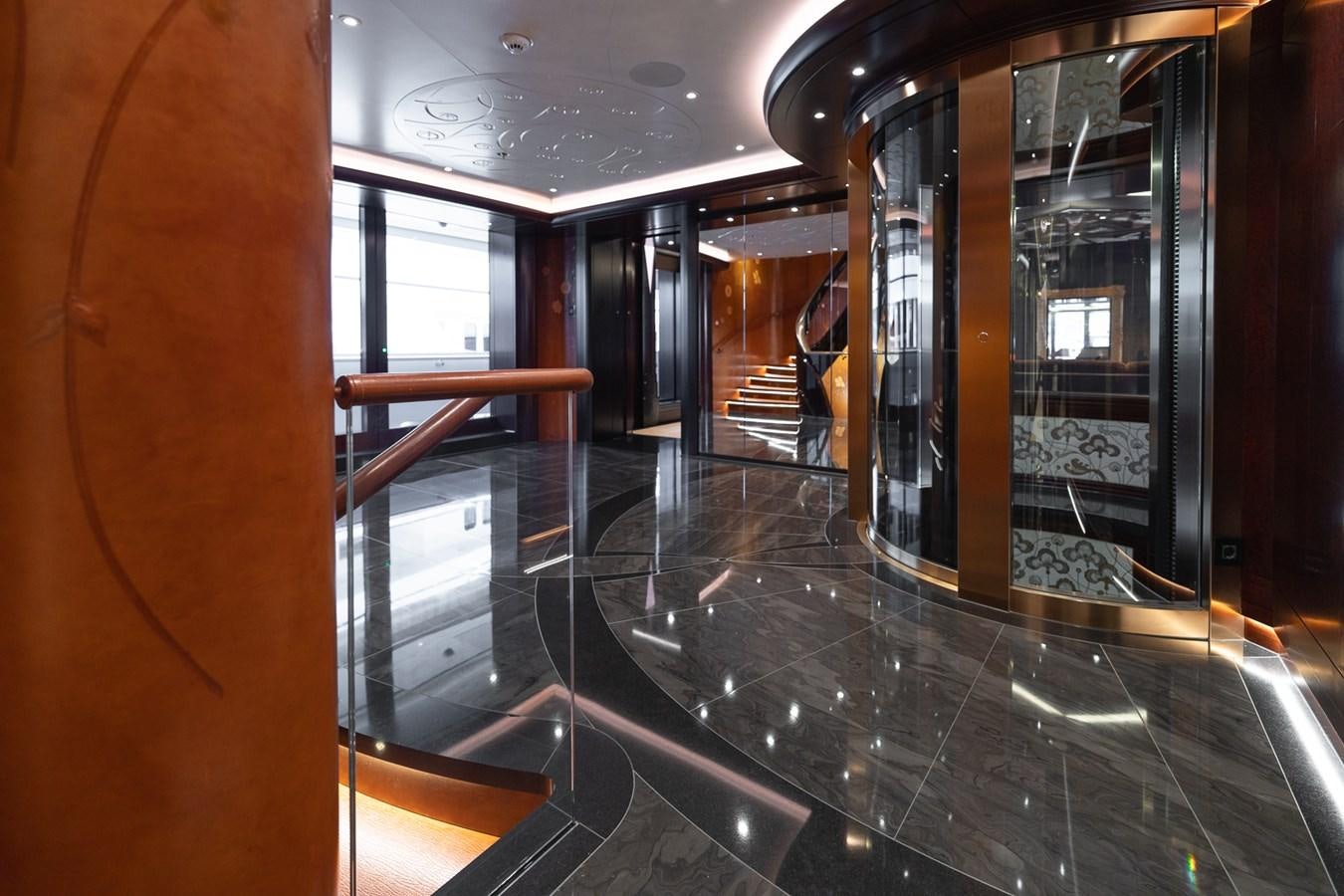 a hallway with glass doors aboard WHISPER Yacht for Sale