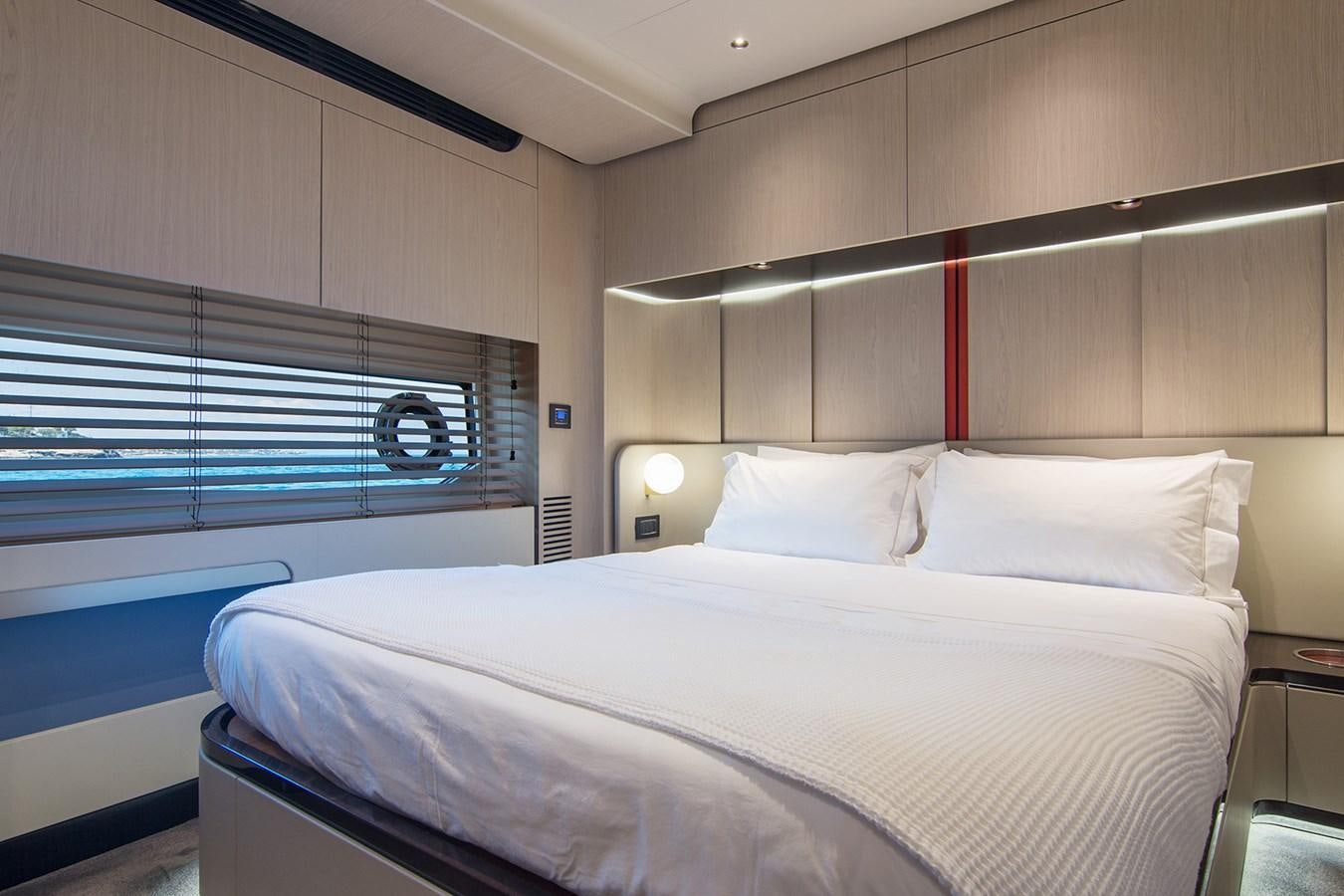 a bed with white sheets aboard GDL Yacht for Sale