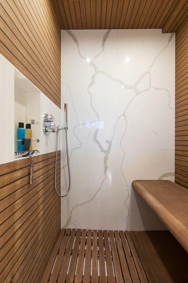 a shower with a wall of white foam aboard GDL Yacht for Sale
