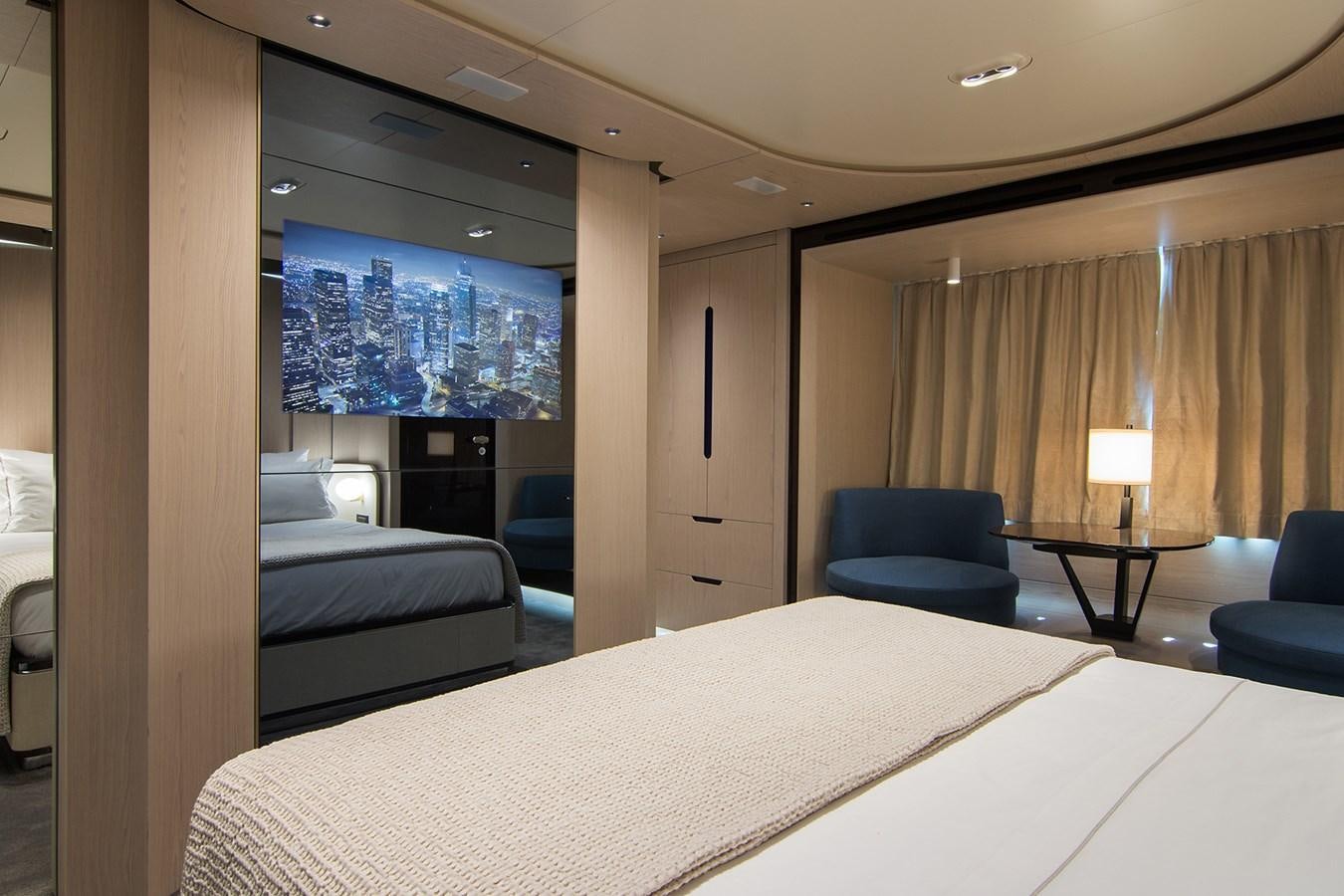 a hotel room with a bed and a chair aboard GDL Yacht for Sale