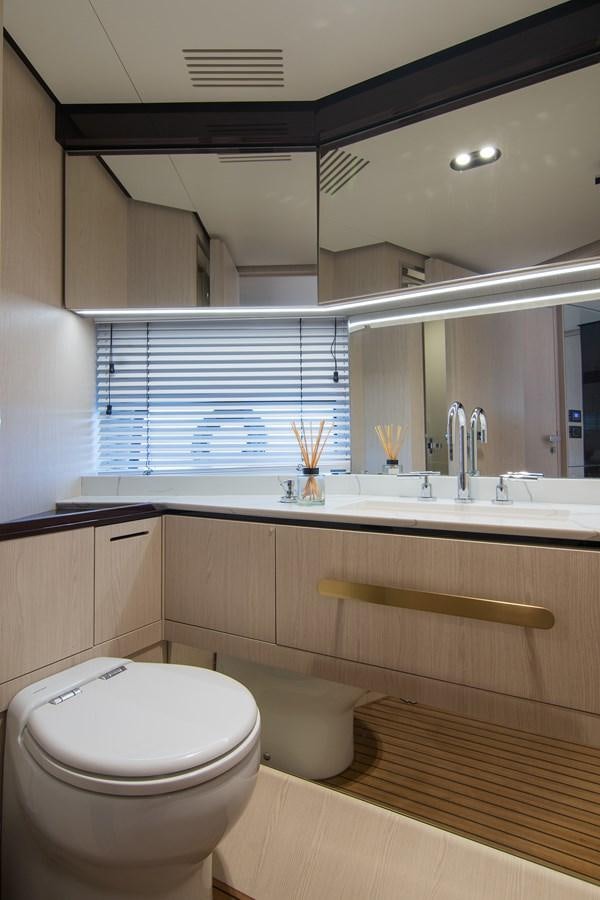 a bathroom with a toilet and a sink aboard GDL Yacht for Sale