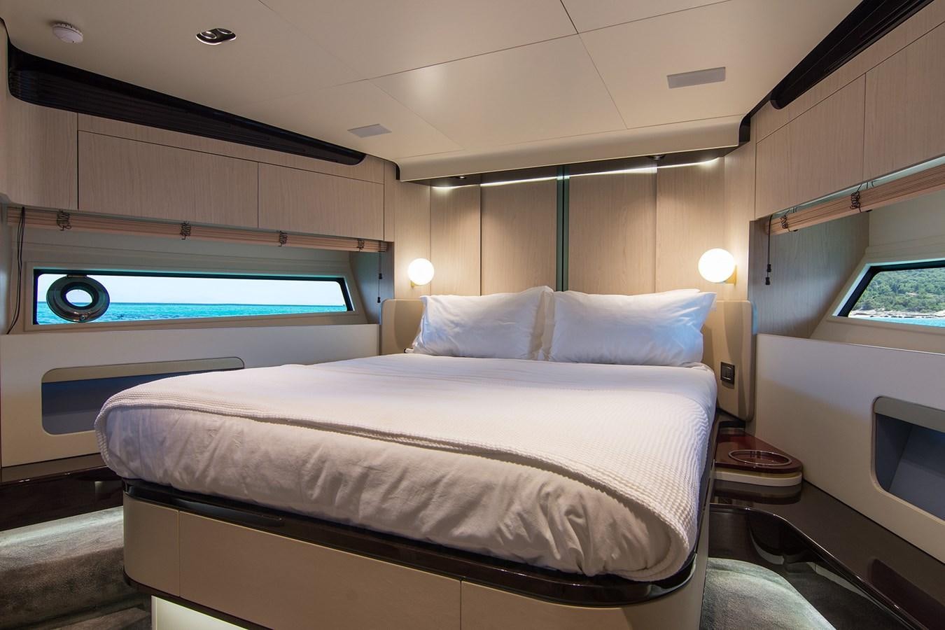 a bed with a white sheet aboard GDL Yacht for Sale