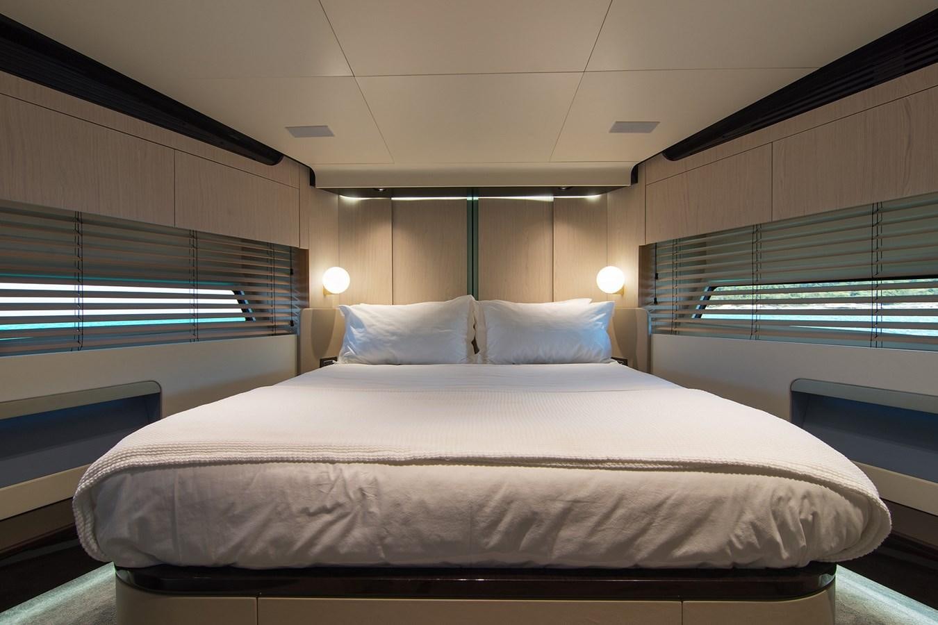 a bed with a white sheet aboard GDL Yacht for Sale