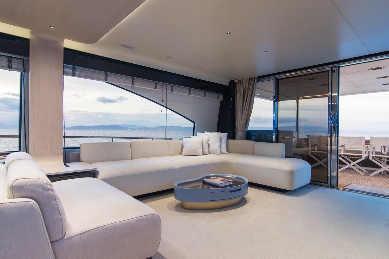 a living room with a large window aboard GDL Yacht for Sale
