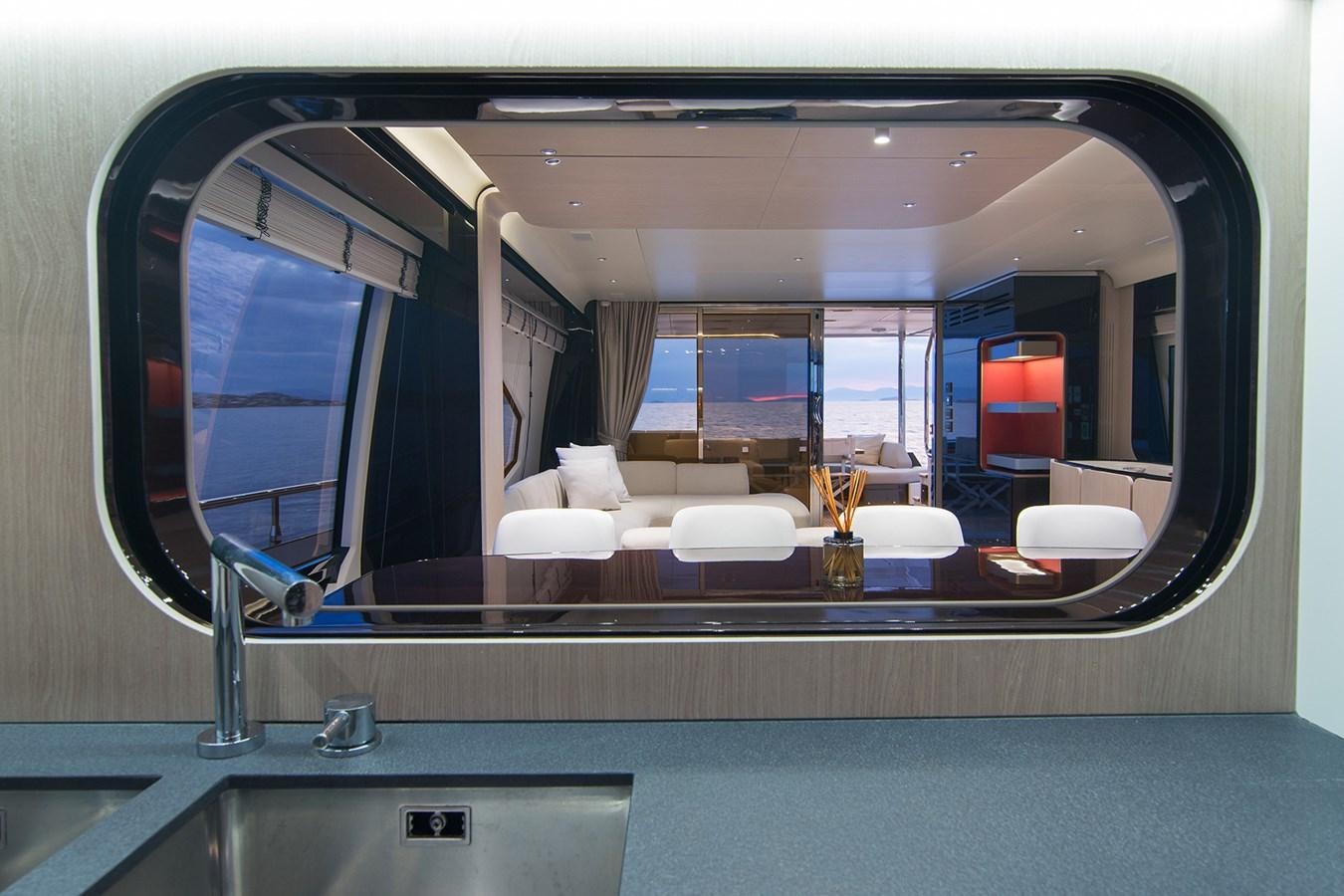 a view of a room with a large window aboard GDL Yacht for Sale