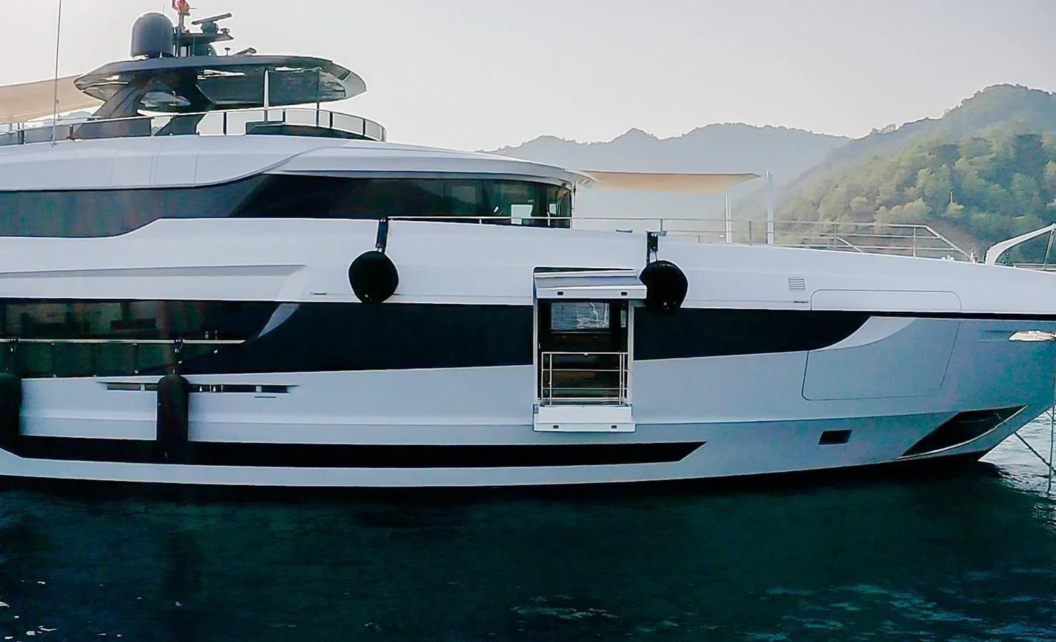 a white yacht on the water aboard UNASOLA Yacht for Sale