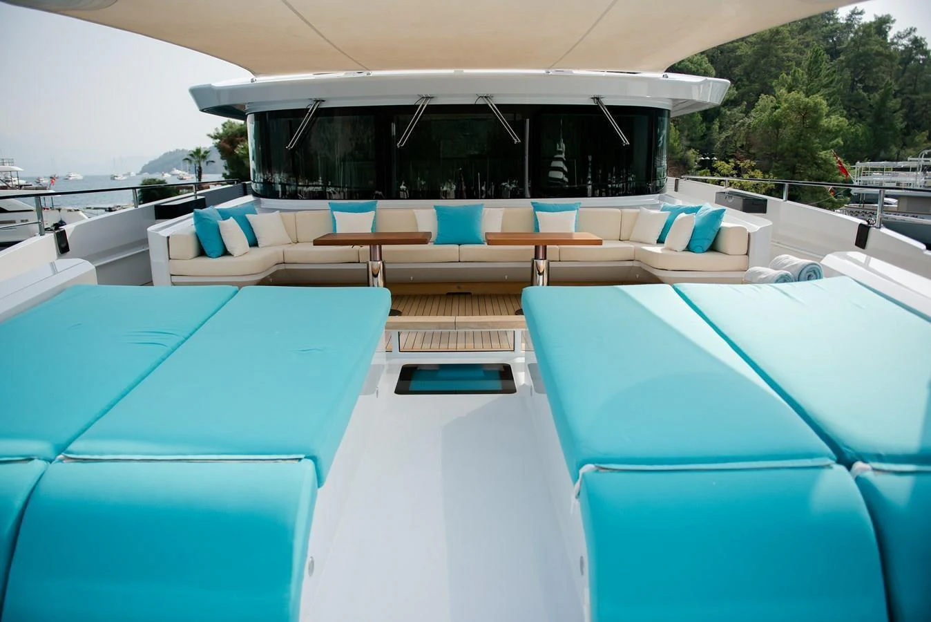 a pool with lounge chairs aboard UNASOLA Yacht for Sale