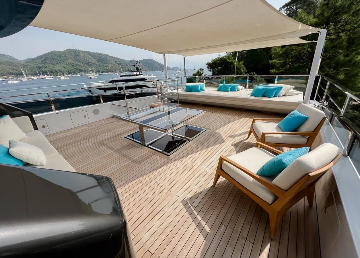 a deck with a chair and a pool aboard UNASOLA Yacht for Sale