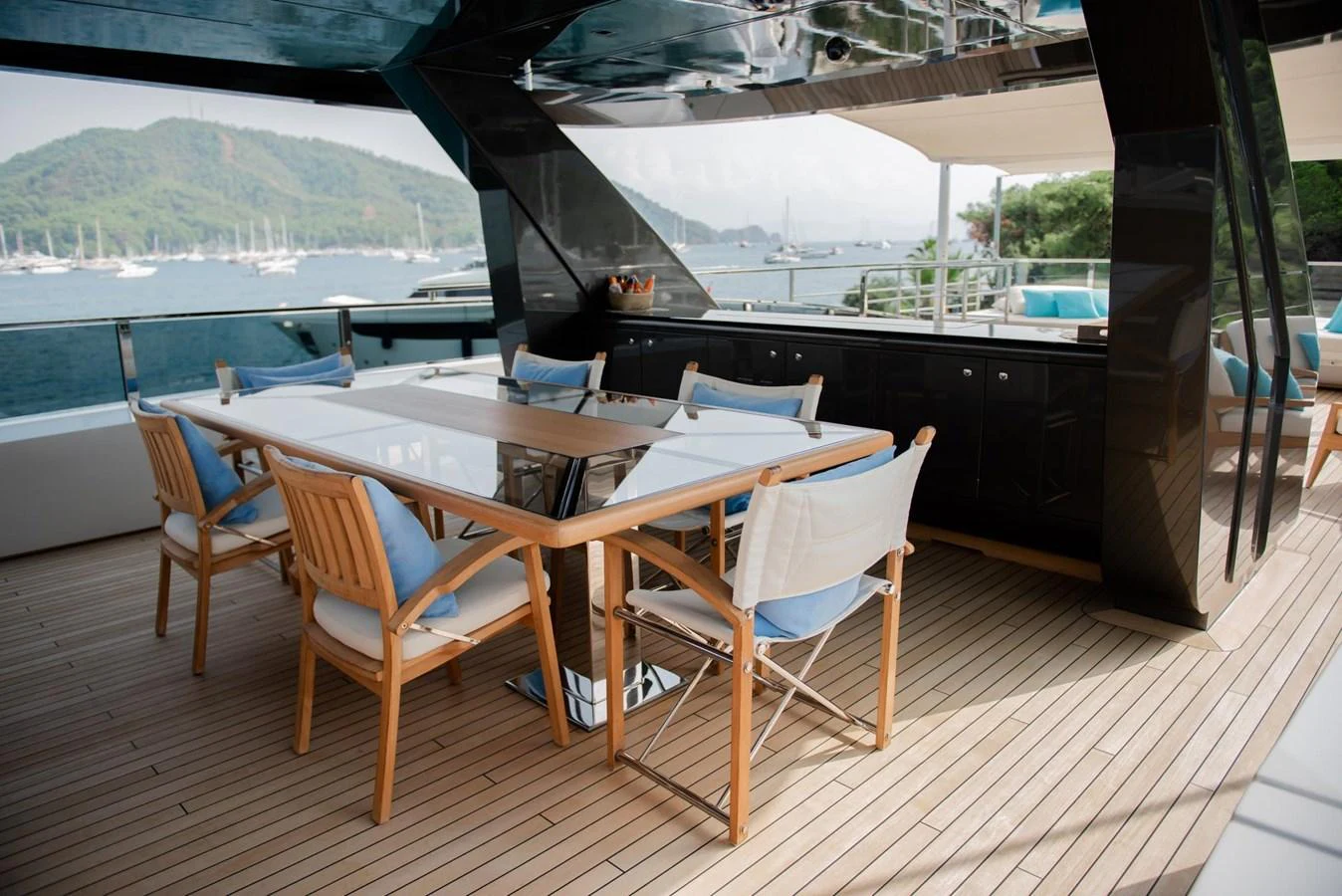 a table and chairs on a deck aboard UNASOLA Yacht for Sale