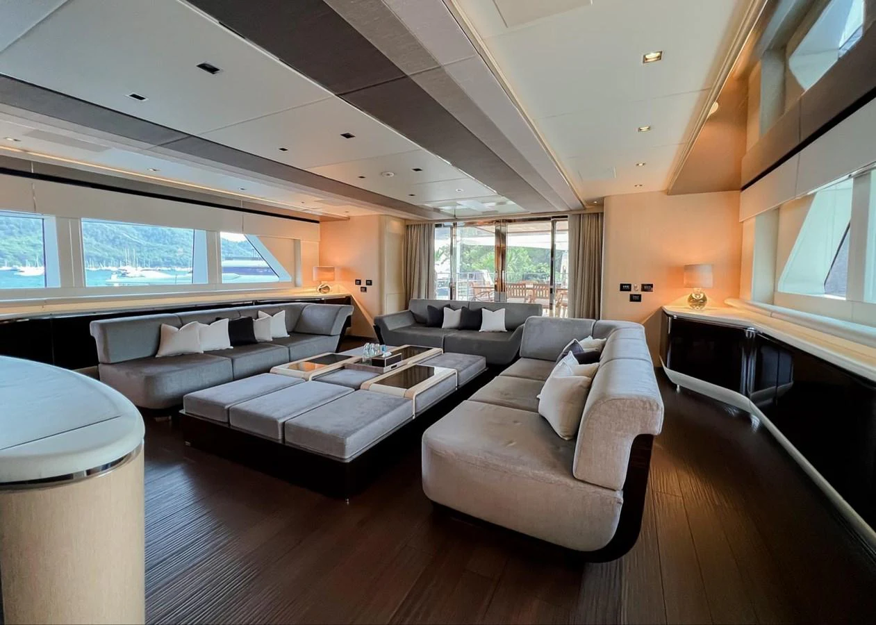 a living room with a couch and a table aboard UNASOLA Yacht for Sale