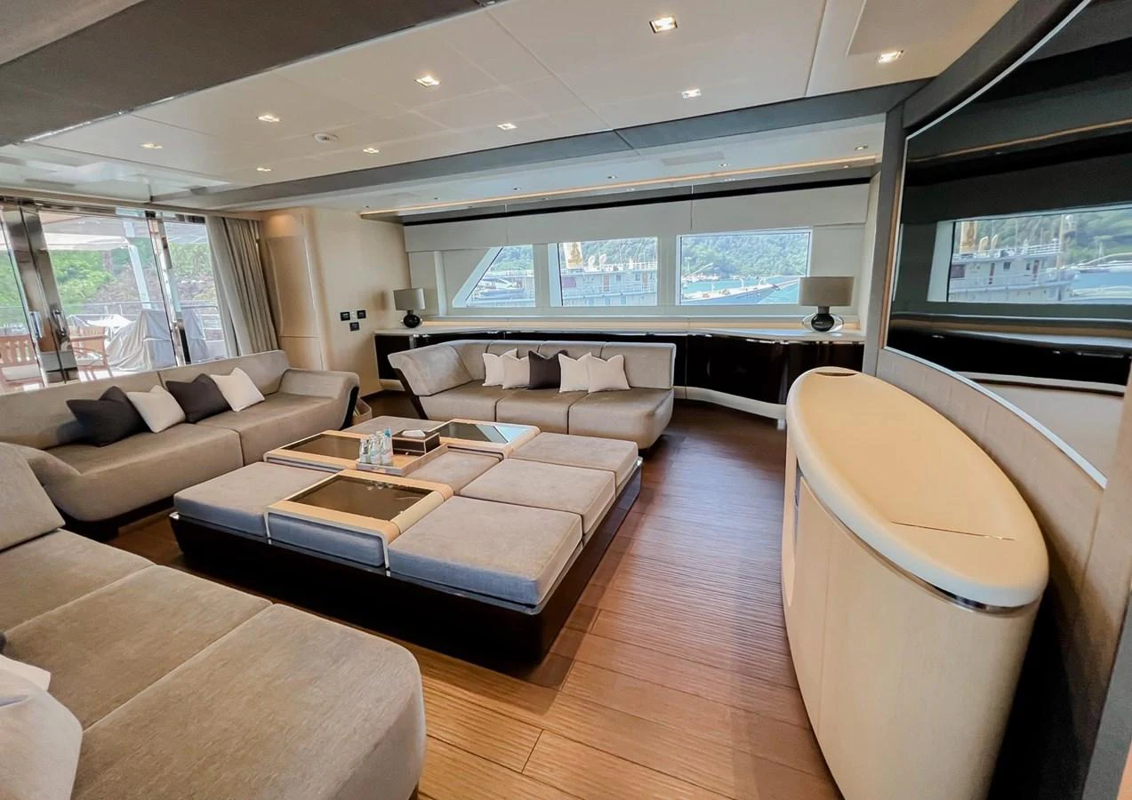 a living room with a large window aboard UNASOLA Yacht for Sale