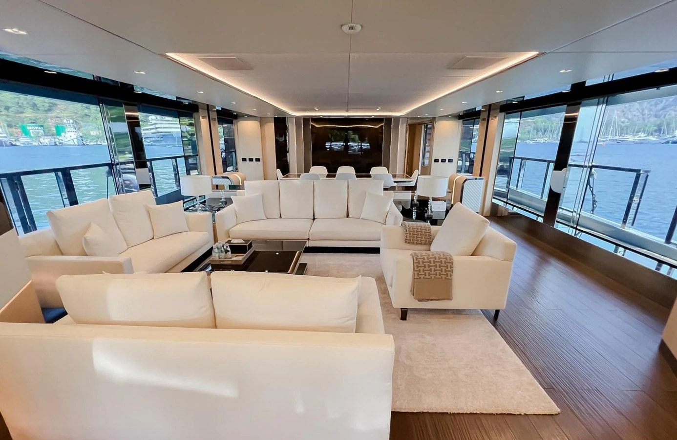 a large living room with a large window aboard UNASOLA Yacht for Sale