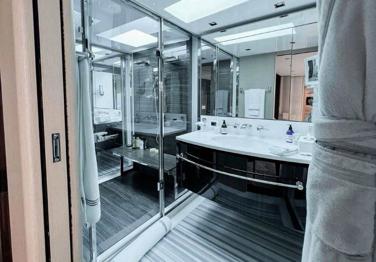 a bathroom with a large mirror aboard UNASOLA Yacht for Sale
