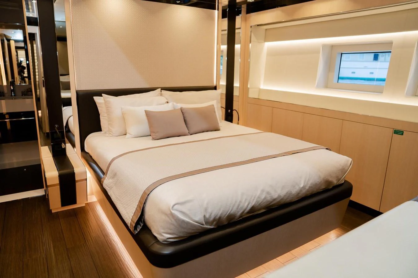 a bed with white sheets aboard UNASOLA Yacht for Sale