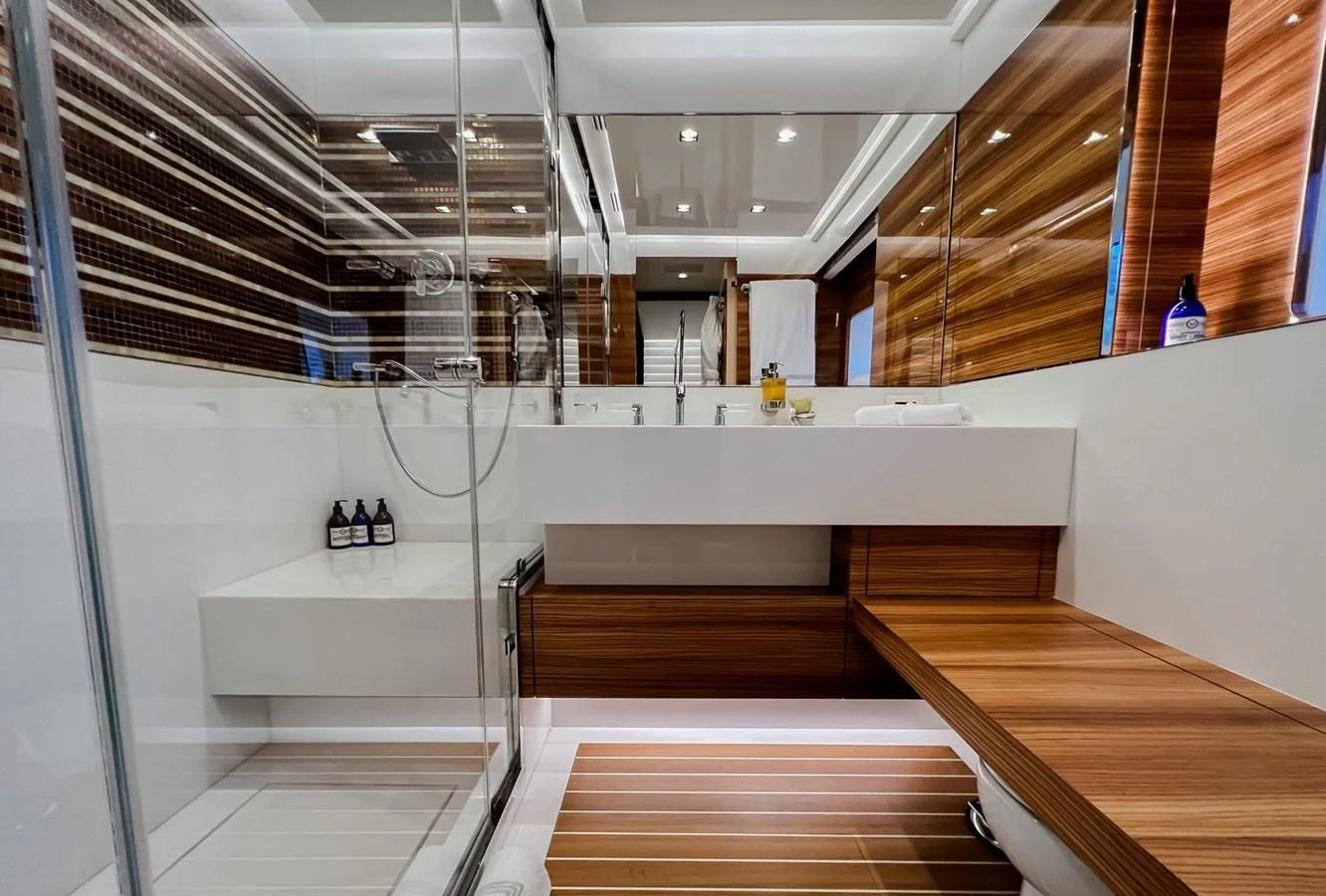 a room with a staircase and a wood floor aboard UNASOLA Yacht for Sale