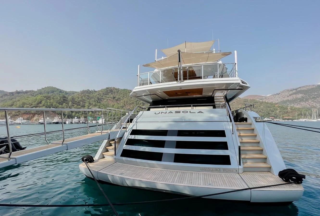 a boat docked at a pier aboard UNASOLA Yacht for Sale