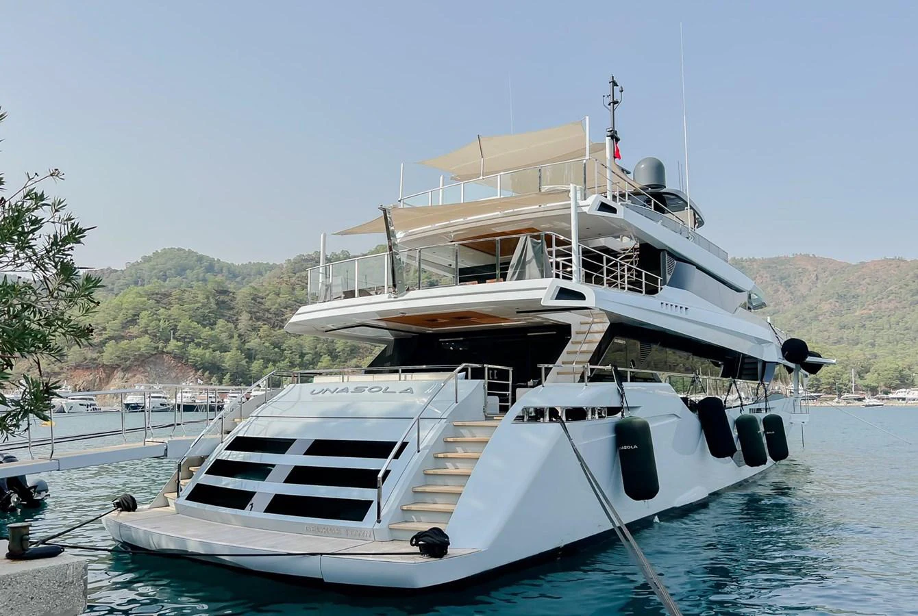 a boat docked in a harbor aboard UNASOLA Yacht for Sale