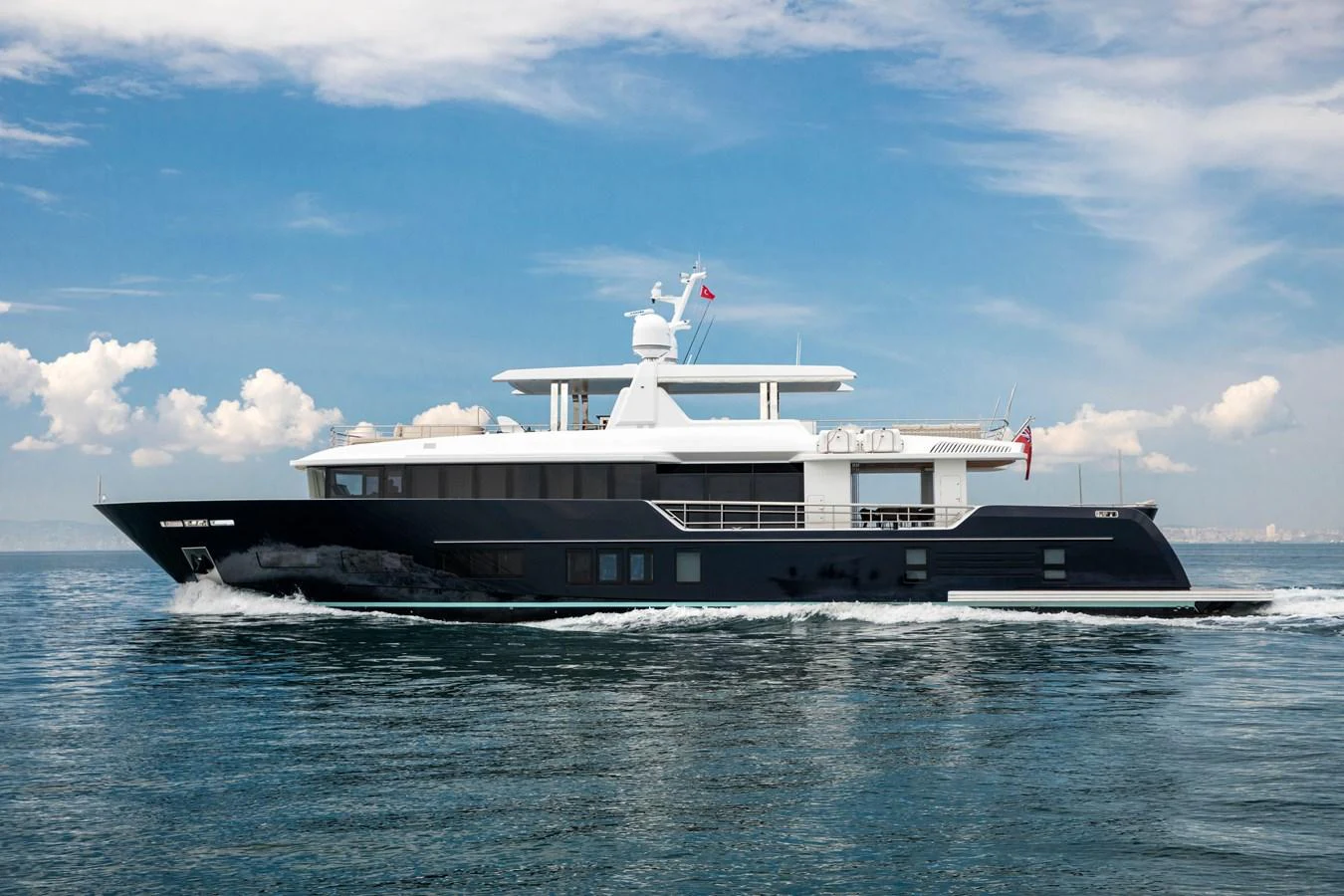 a large ship in the water aboard PICCOLO @ FLIBS Yacht for Sale