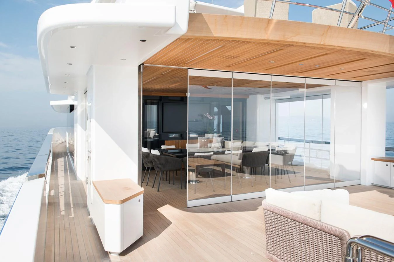 a room with a wood ceiling and a white lounge chair and a wood ceiling aboard PICCOLO @ FLIBS Yacht for Sale