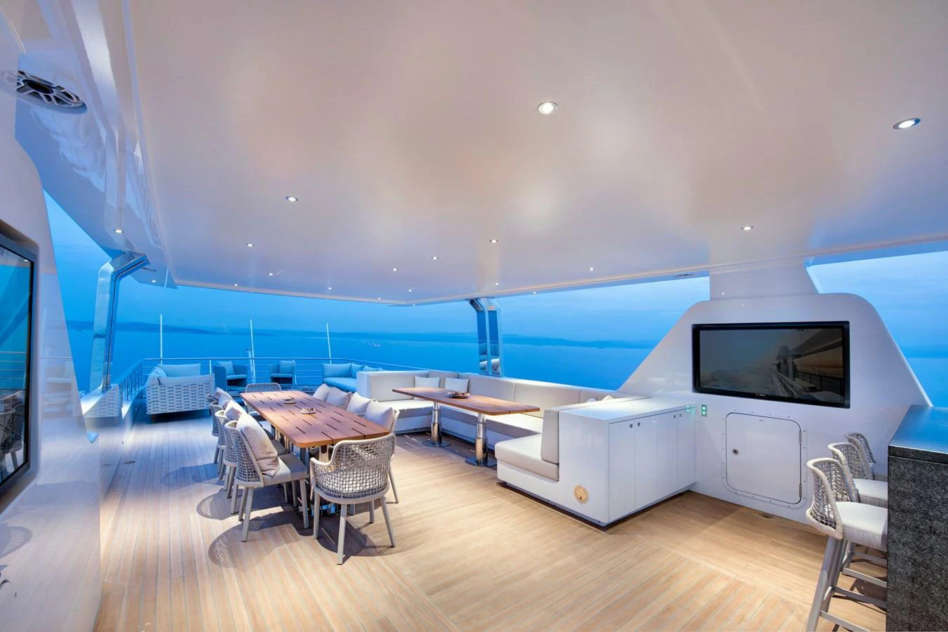 a room with a pool table and chairs aboard PICCOLO @ FLIBS Yacht for Sale