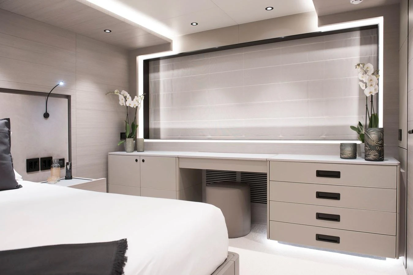 a room with a bed and a desk aboard PICCOLO @ FLIBS Yacht for Sale