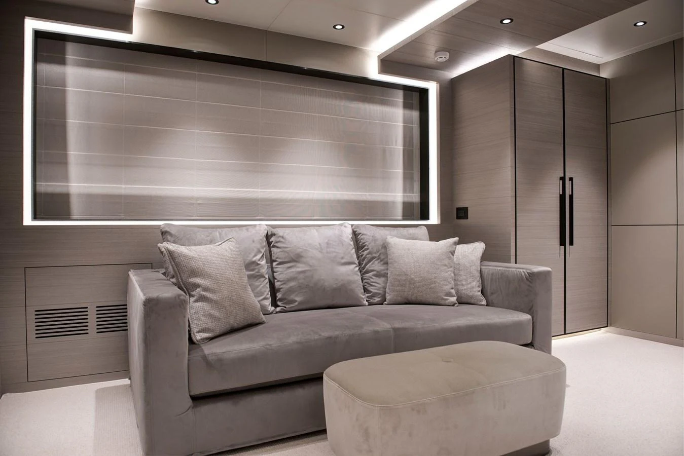 a couch in a room aboard PICCOLO @ FLIBS Yacht for Sale