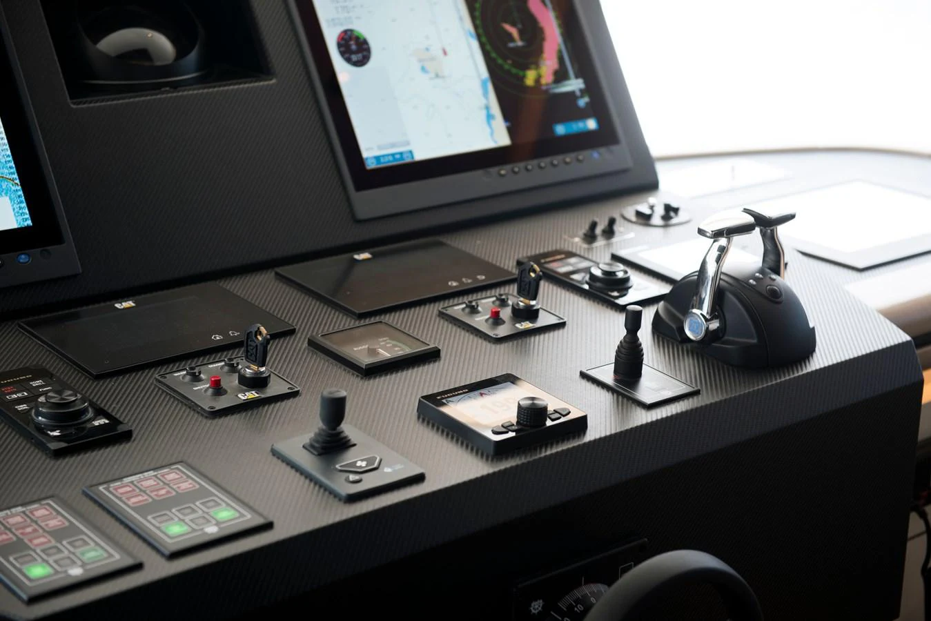 a desk with a computer monitor and other electronics on it aboard PICCOLO @ FLIBS Yacht for Sale