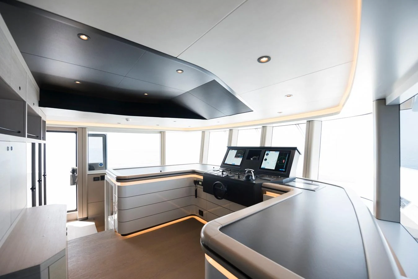 a room with a table and chairs aboard PICCOLO @ FLIBS Yacht for Sale