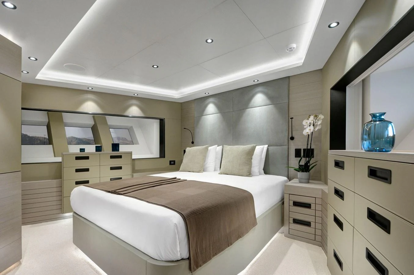 a bedroom with a large bed aboard PICCOLO @ FLIBS Yacht for Sale