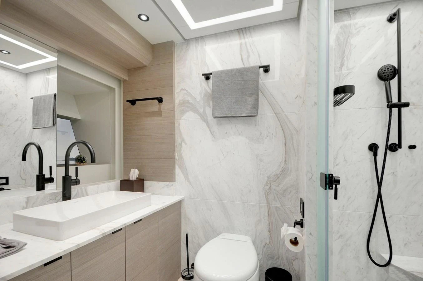 a bathroom with a shower curtain aboard PICCOLO @ FLIBS Yacht for Sale