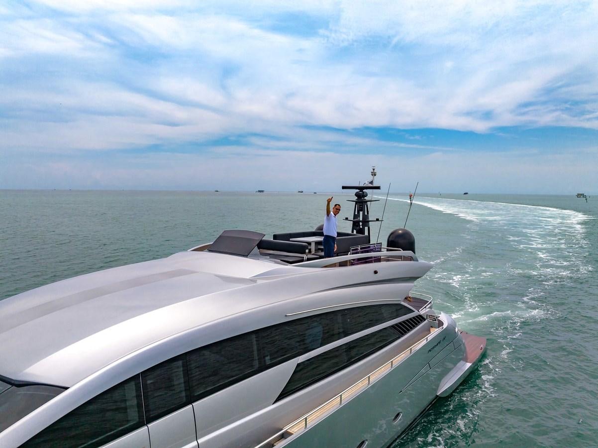 a person standing on a boat aboard ARENA Yacht for Sale