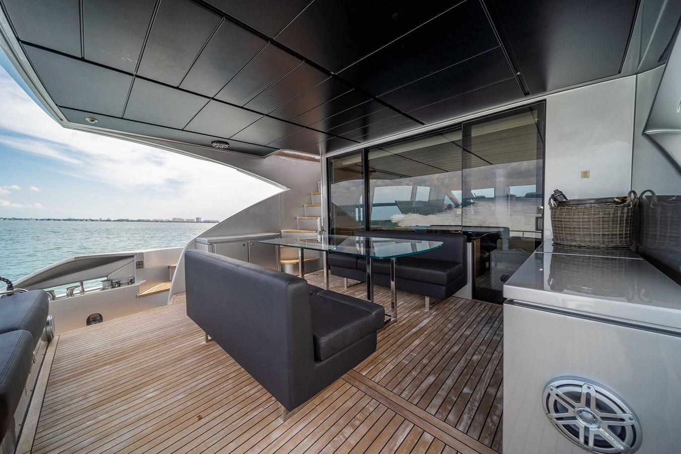 a room with a couch and a table and a large body of water aboard ARENA Yacht for Sale