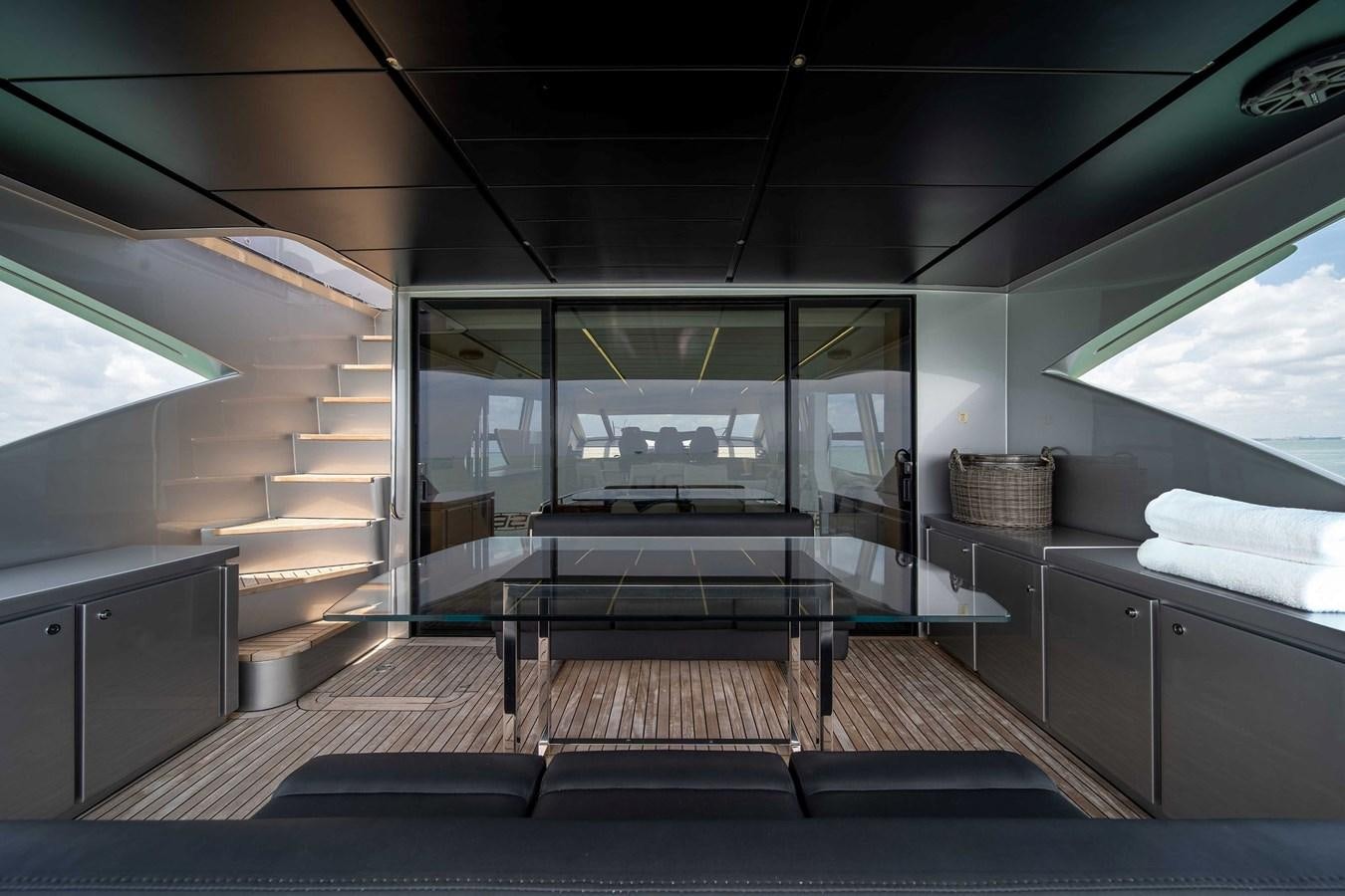 a room with a staircase and a glass door aboard ARENA Yacht for Sale