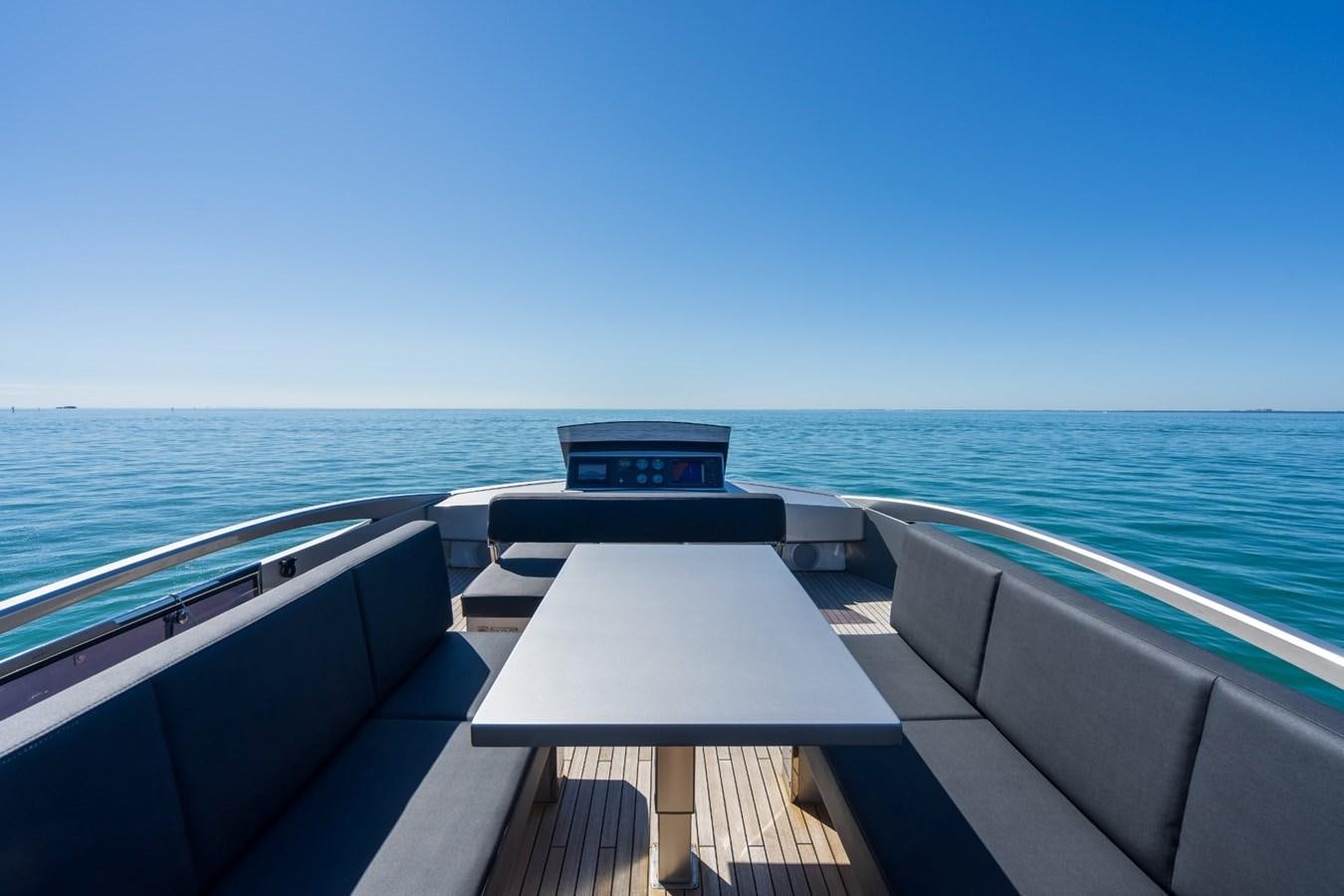 a deck with a view of the ocean and the ocean aboard ARENA Yacht for Sale