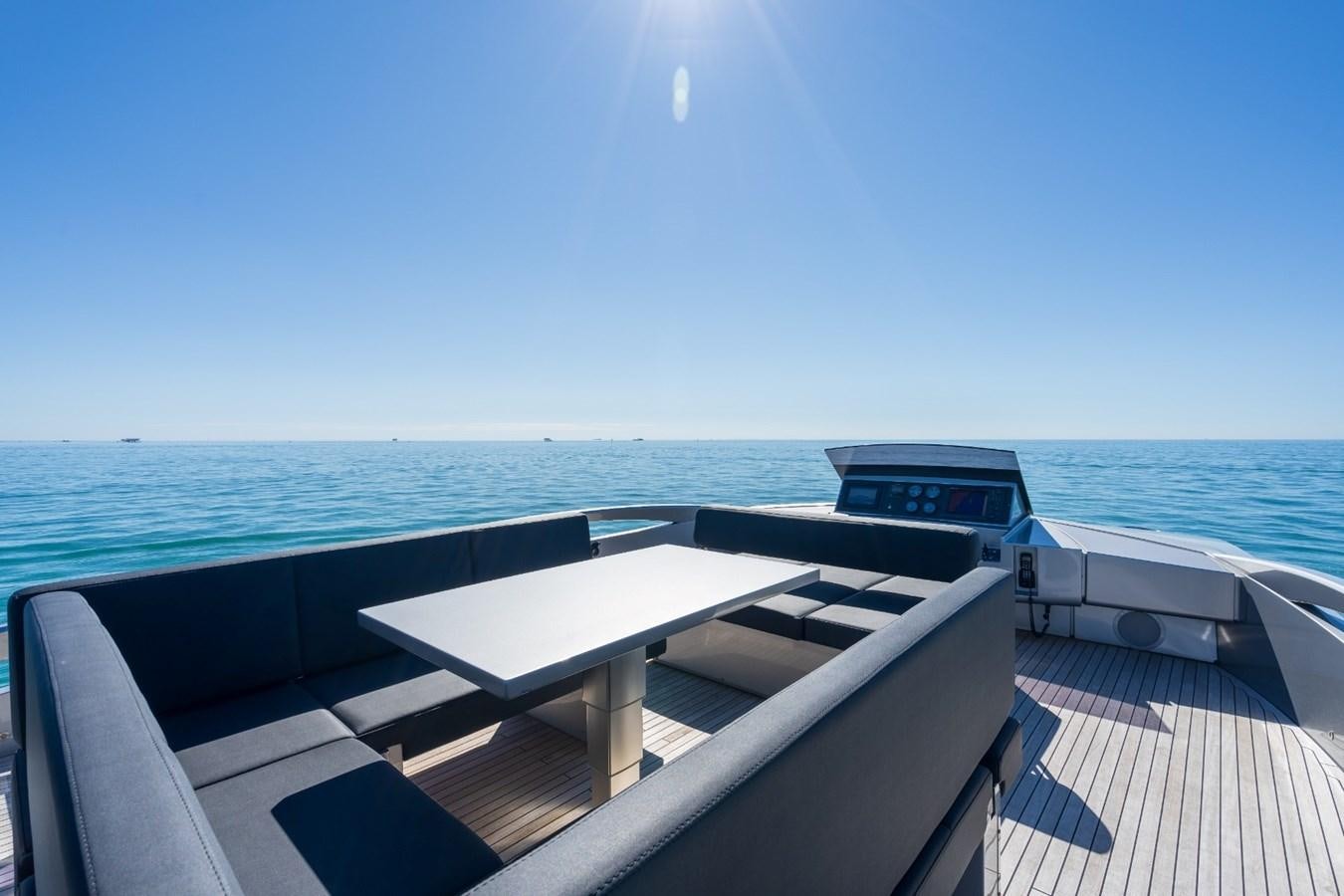a deck with a view of the ocean and a beach aboard ARENA Yacht for Sale