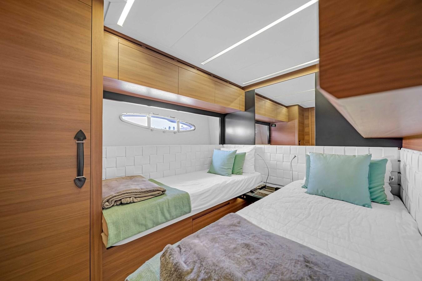 a room with two beds aboard ARENA Yacht for Sale