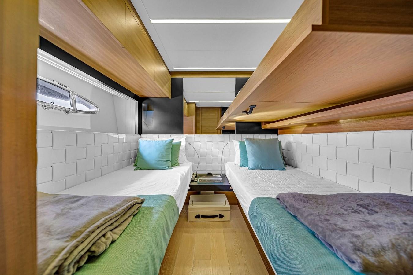 a room with two beds aboard ARENA Yacht for Sale