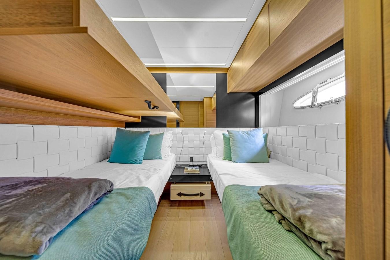 a room with two beds aboard ARENA Yacht for Sale