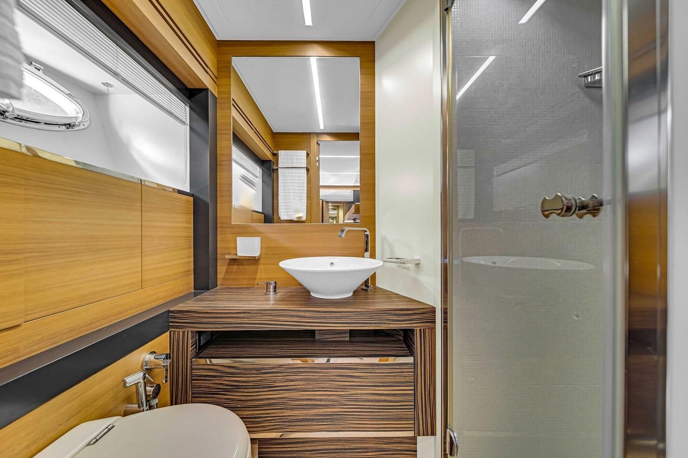 a bathroom with a sink and a shower aboard ARENA Yacht for Sale