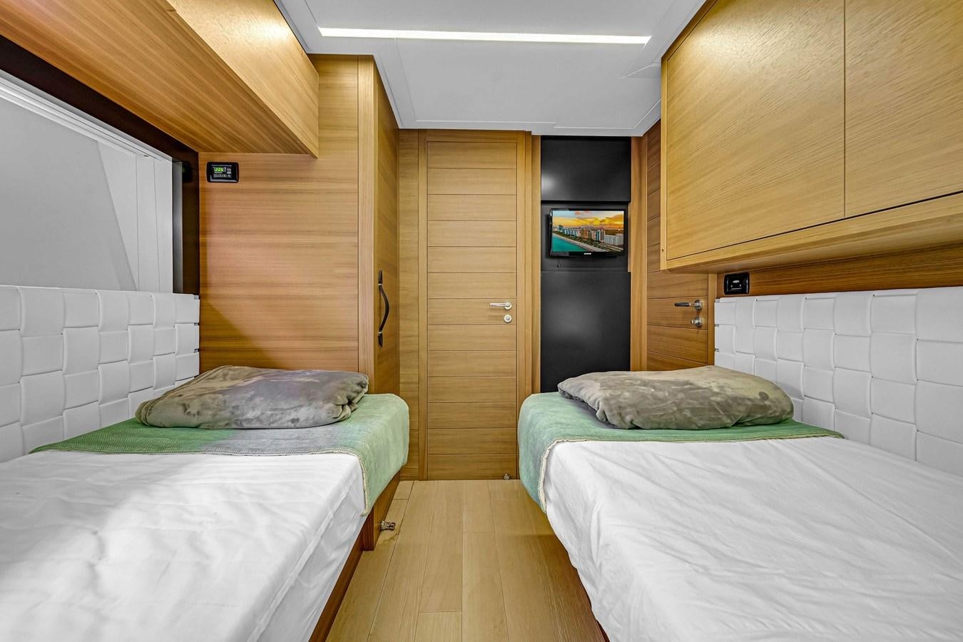 a room with two beds aboard ARENA Yacht for Sale