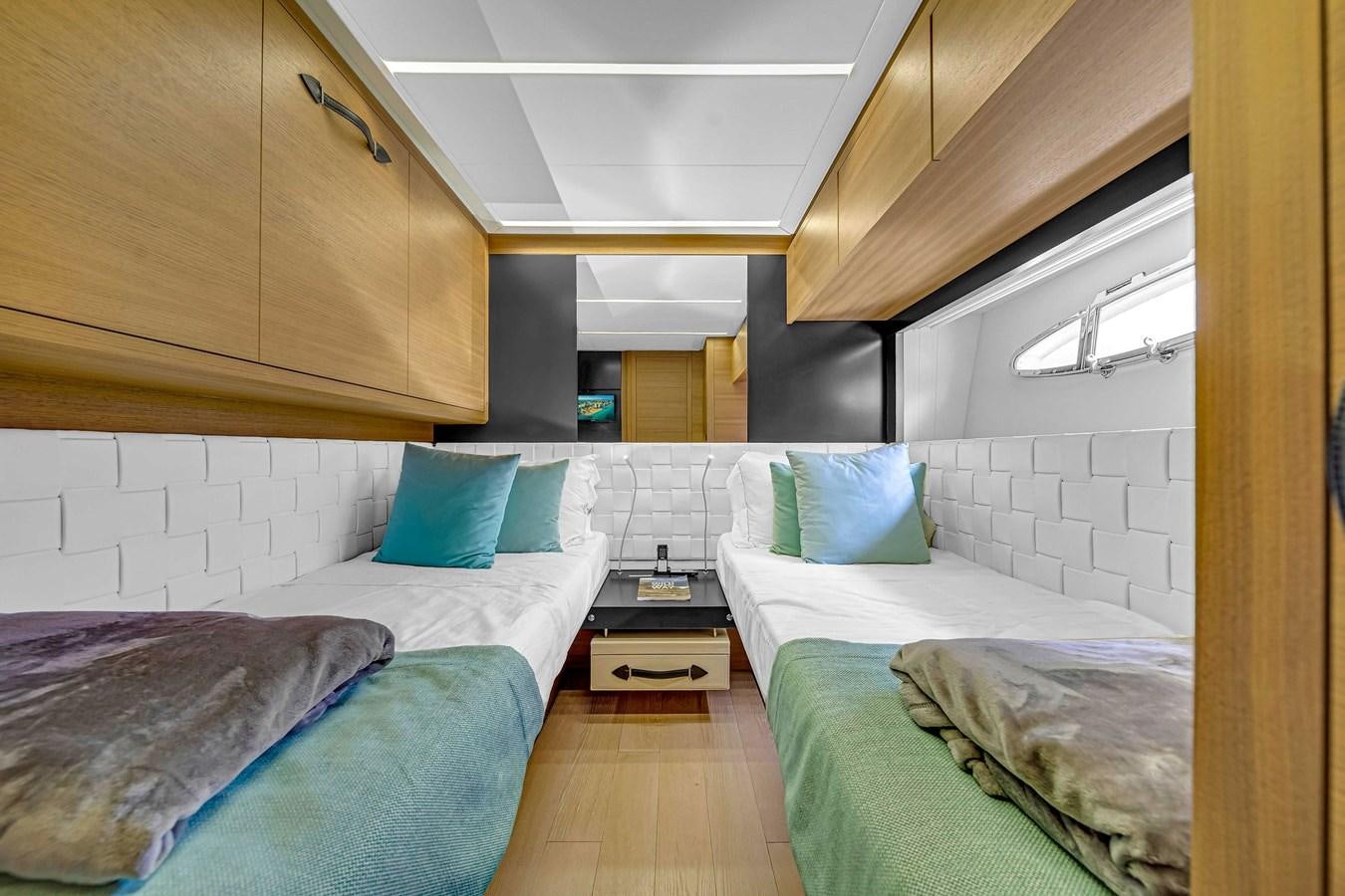 a room with two beds aboard ARENA Yacht for Sale