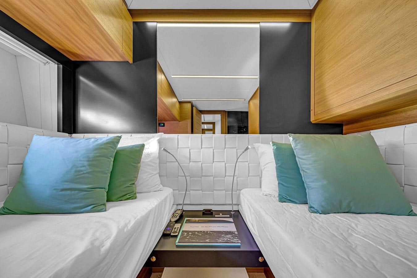 a room with two beds aboard ARENA Yacht for Sale
