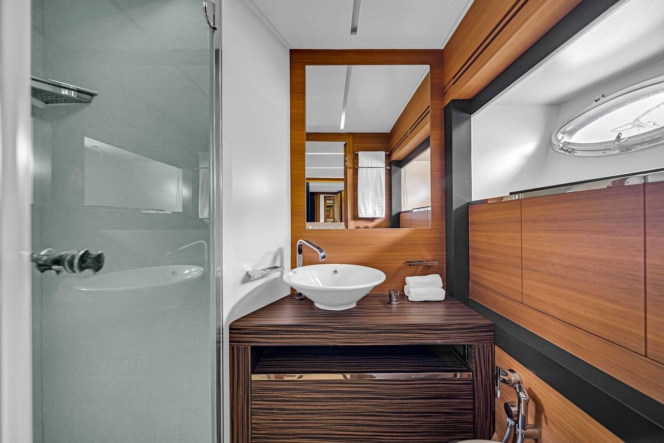 a bathroom with a sink and a shower aboard ARENA Yacht for Sale