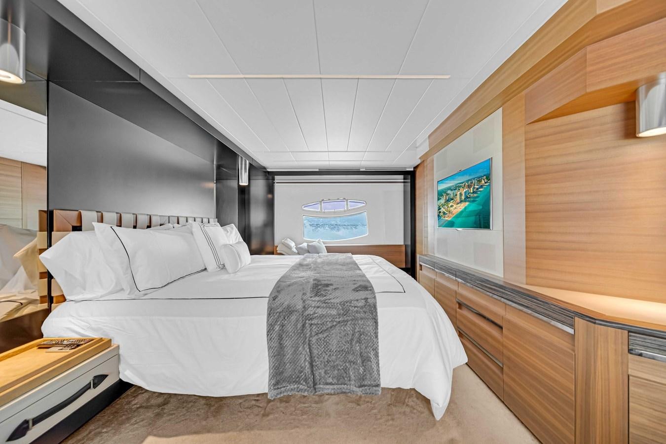 a room with a bed and a desk aboard ARENA Yacht for Sale