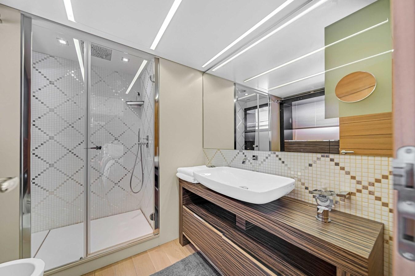 a bathroom with a glass shower aboard ARENA Yacht for Sale