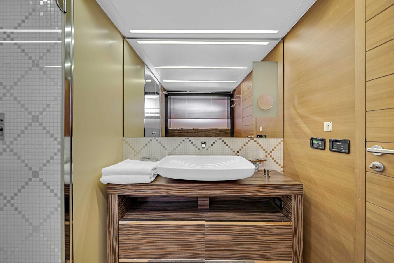 a bathroom with a sink and a mirror aboard ARENA Yacht for Sale