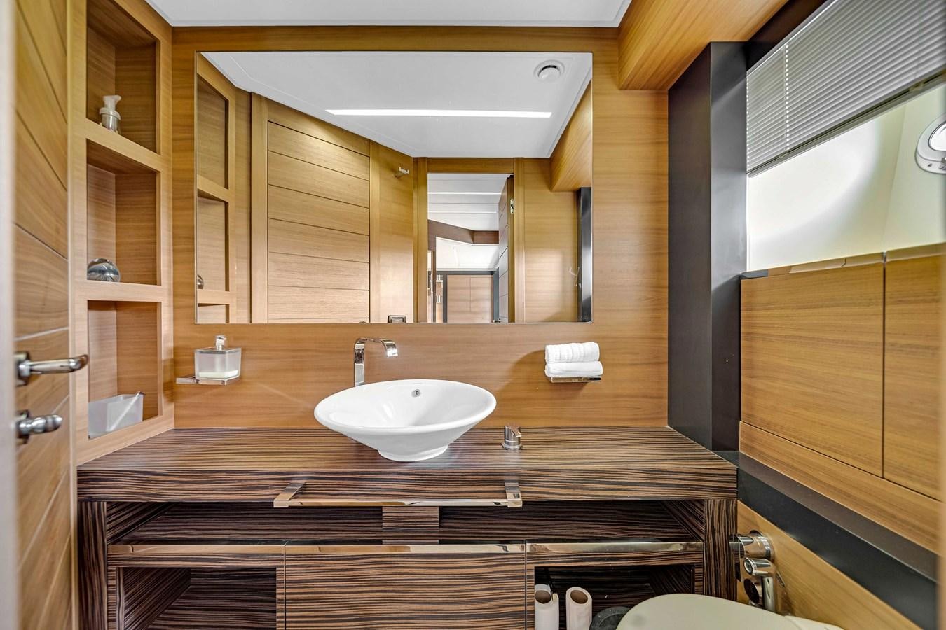 a bathroom with a sink and a mirror aboard ARENA Yacht for Sale