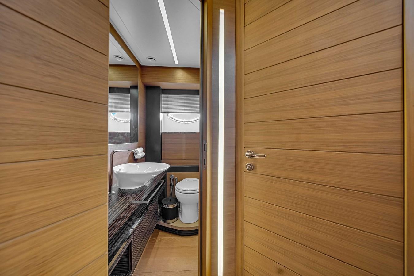 a bathroom with wooden walls aboard ARENA Yacht for Sale