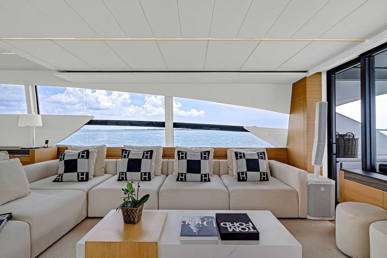 a living room with a large window aboard ARENA Yacht for Sale